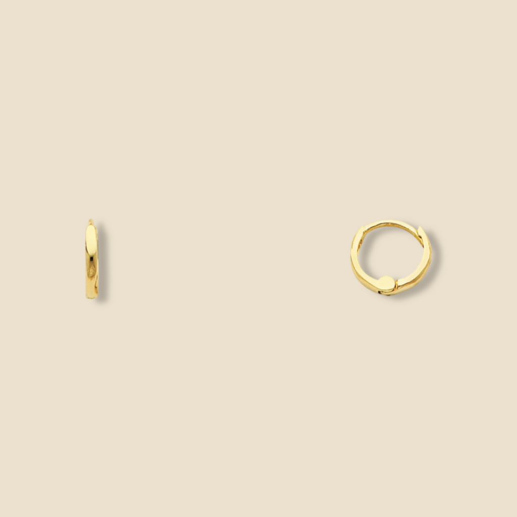 14K Gold Small Plain Huggie Earrings in yellow gold displayed on a plain background, highlighting their minimalist design, polished finish, and dainty 8 mm size.