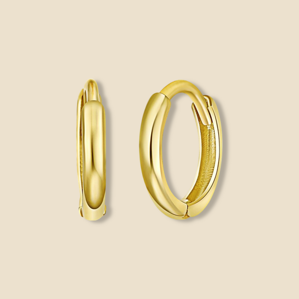 14K Gold Small Plain Huggie Earrings in yellow gold displayed on a plain background, highlighting their minimalist design, polished finish, and dainty 8 mm size.